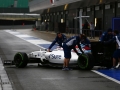 Silverstone, Northamptonshire, UK.Tuesday 12 July 2016.Alex Lynn, Williams FW38 Mercedes, is wheeled back in the pit lane by mechanics.Photo: Zak Mauger/Wiliams F1ref: Digital Image _79P0267